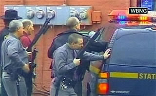 cops waiting behind cars at Binghamton, NY shooting